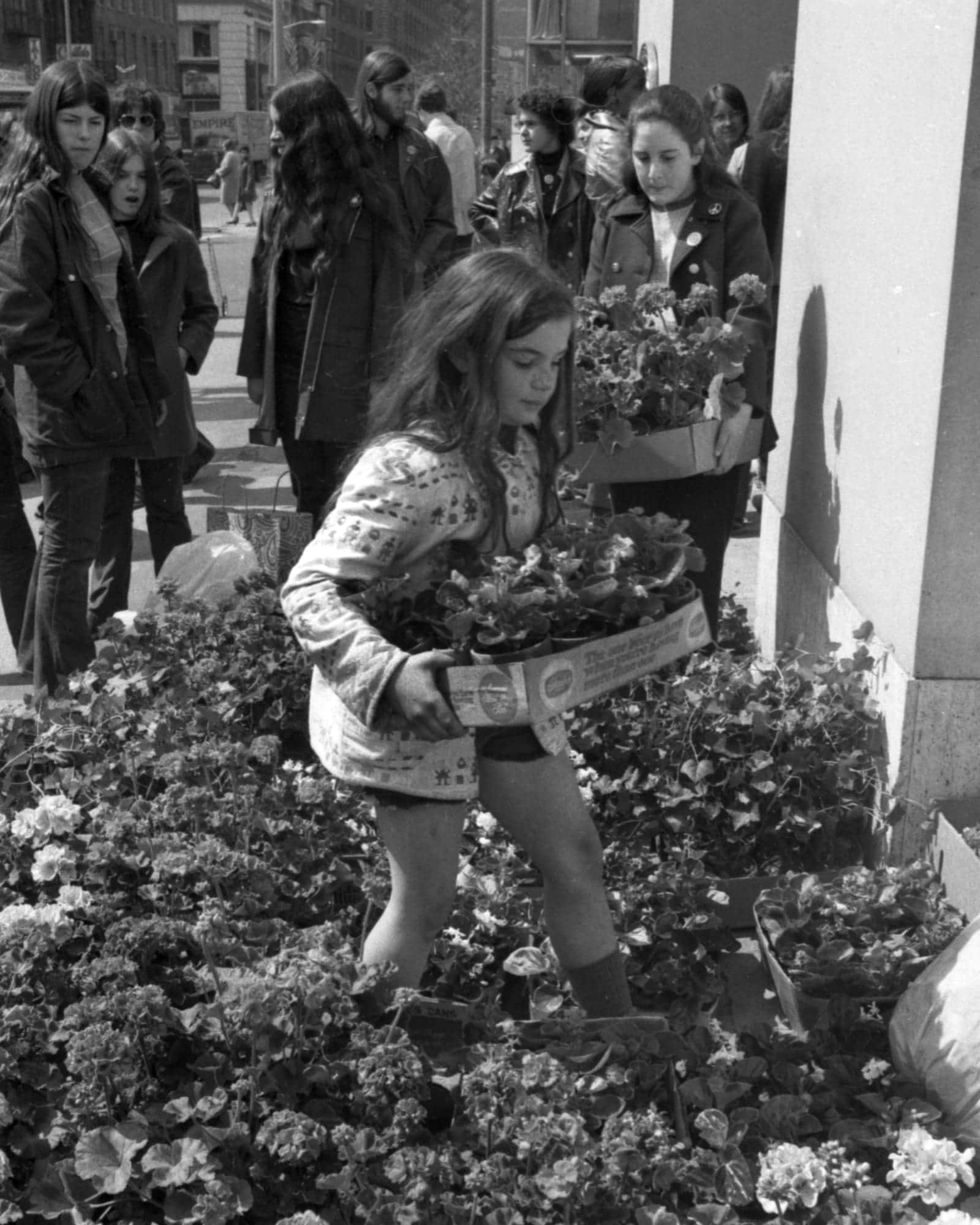 In NYC's Union Square, girls planting flowers, April 22, 1970 for Earth Day
