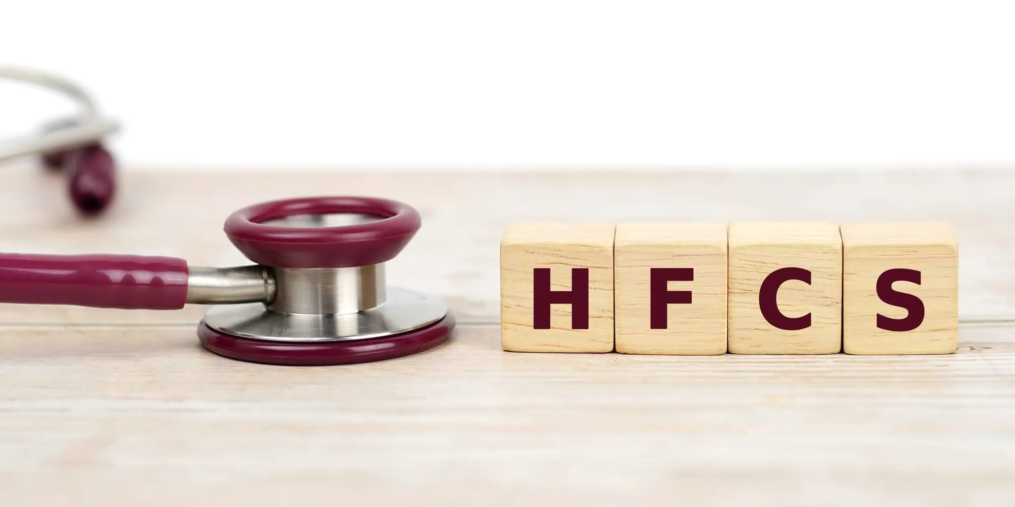 HFCS on wooden blocks, a doctor's tool next to them.